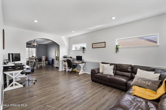 8747 Salmonberry Lp, Hayden, ID 83835 - living room with arched walkways, an office area, wood finished floors, recessed lighting, and a chandelier