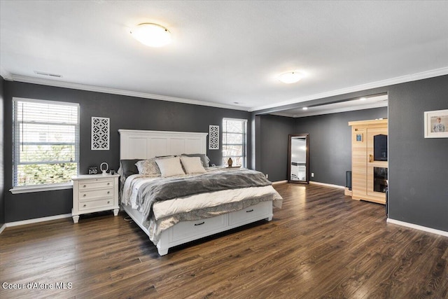 8747 Salmonberry Lp, Hayden, ID 83835 - bedroom with ornamental molding, baseboards, and dark wood-style flooring