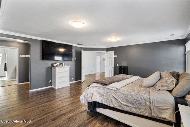 8747 Salmonberry Lp, Hayden, ID 83835 - bedroom with ornamental molding, baseboards, and dark wood-style floors