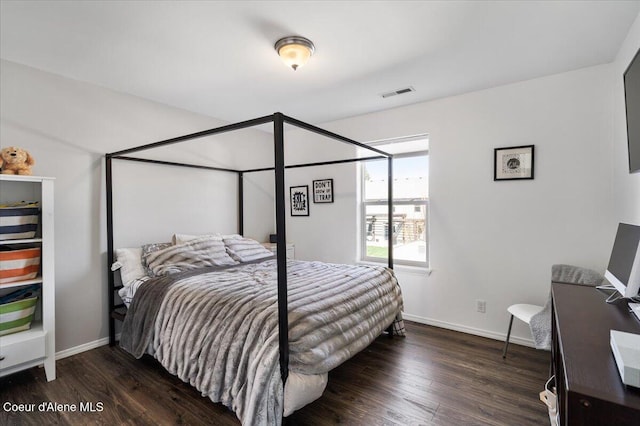 8747 Salmonberry Lp, Hayden, ID 83835 - bedroom featuring wood finished floors and baseboards