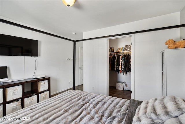 8747 Salmonberry Lp, Hayden, ID 83835 - bedroom with a walk in closet, a closet, and wood finished floors