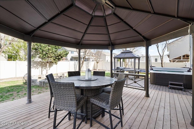 8747 Salmonberry Lp, Hayden, ID 83835 - wooden deck featuring a gazebo, a hot tub, a fenced backyard, and outdoor dining area
