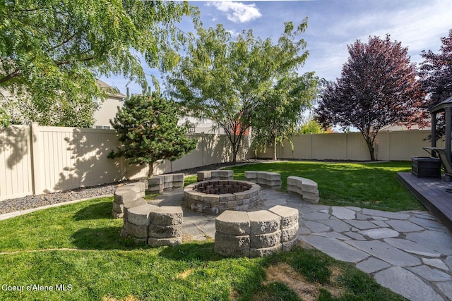 8747 Salmonberry Lp, Hayden, ID 83835 - view of yard featuring a fire pit and a patio