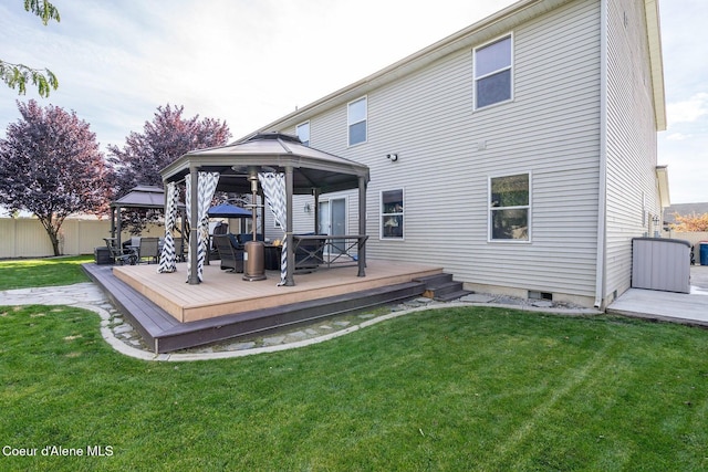 8747 Salmonberry Lp, Hayden, ID 83835 - back of property with a gazebo and a wooden deck