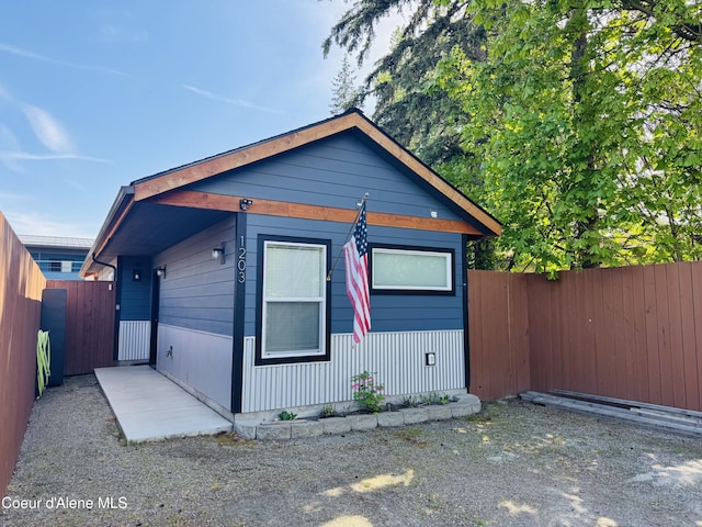 1203 Chestnut St, Sandpoint, ID 83864 - view of front of house with a fenced backyard and a gate