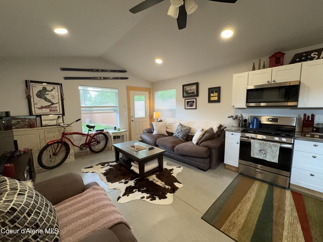 1203 Chestnut St, Sandpoint, ID 83864 - living room featuring lofted ceiling, a ceiling fan, finished concrete floors, and recessed lighting