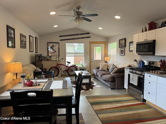 1203 Chestnut St, Sandpoint, ID 83864 - kitchen with stainless steel appliances, white cabinetry, lofted ceiling, ceiling fan, and open floor plan