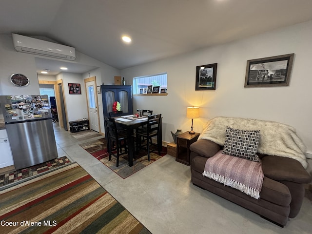 1203 Chestnut St, Sandpoint, ID 83864 - living room with an AC wall unit, lofted ceiling, recessed lighting, and baseboards