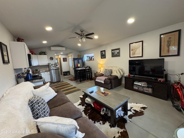 1203 Chestnut St, Sandpoint, ID 83864 - living room featuring light carpet, vaulted ceiling, a ceiling fan, recessed lighting, and an AC wall unit