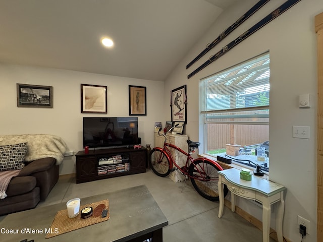 1203 Chestnut St, Sandpoint, ID 83864 - living area featuring concrete flooring and vaulted ceiling