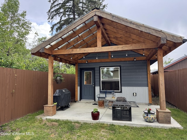 1203 Chestnut St, Sandpoint, ID 83864 - back of house featuring a fenced backyard and a patio