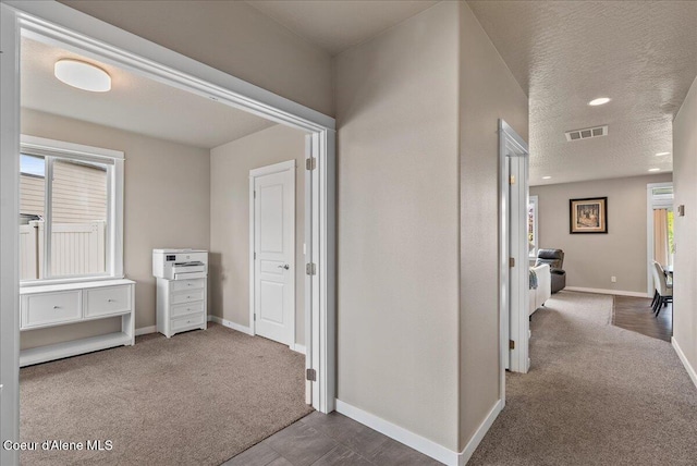 3402 N Croghan Dr, Post Falls, ID 83854 - hall featuring carpet, baseboards, recessed lighting, and a textured ceiling