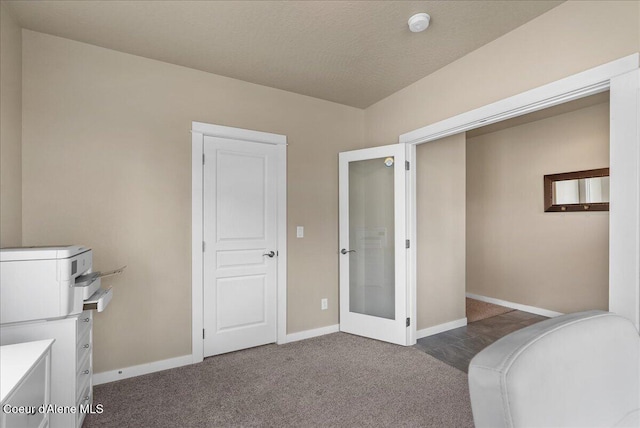 3402 N Croghan Dr, Post Falls, ID 83854 - bedroom featuring baseboards, dark carpet, and french doors
