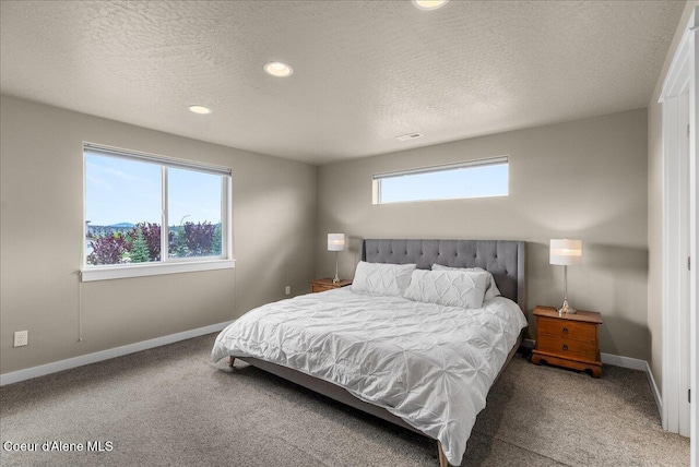 3402 N Croghan Dr, Post Falls, ID 83854 - carpeted bedroom with baseboards, a textured ceiling, and recessed lighting