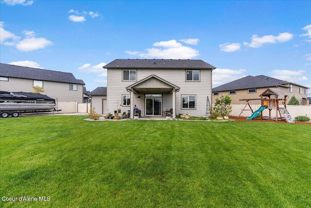 3402 N Croghan Dr, Post Falls, ID 83854 - back of house featuring a playground and a patio area
