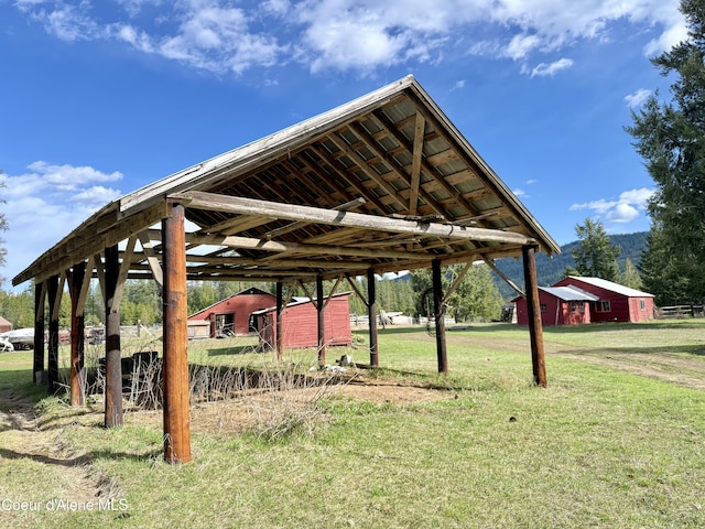 3216 Dufort Rd, Sagle, ID 83860 - view of property's community featuring a carport, a lawn, and an outdoor structure