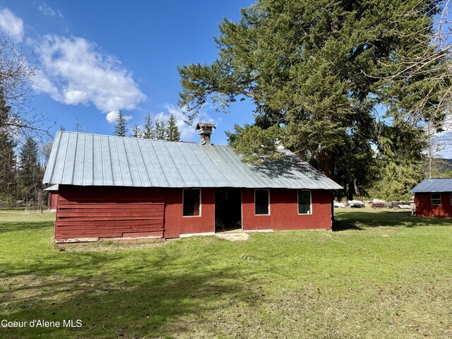 3216 Dufort Rd, Sagle, ID 83860 - view of front of house with a front lawn and metal roof