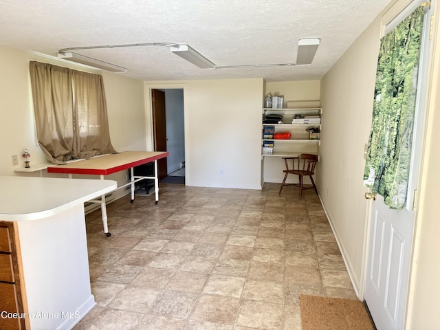 3216 Dufort Rd, Sagle, ID 83860 - office area featuring a textured ceiling and baseboards