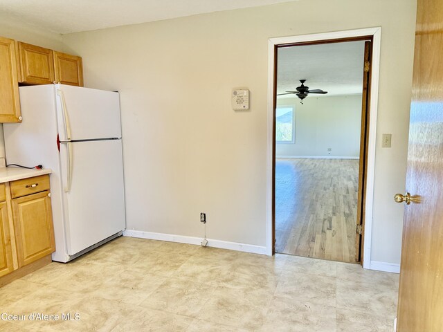 3216 Dufort Rd, Sagle, ID 83860 - kitchen featuring freestanding refrigerator, ceiling fan, baseboards, and light countertops