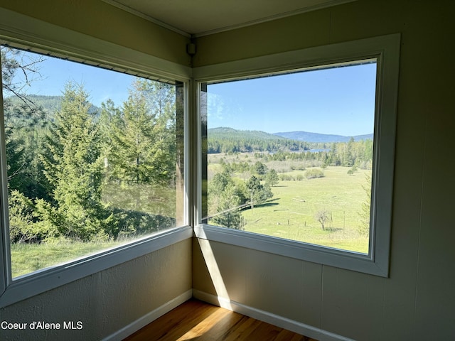3216 Dufort Rd, Sagle, ID 83860 - unfurnished sunroom featuring a mountain view and a forest view