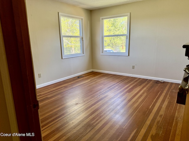 3216 Dufort Rd, Sagle, ID 83860 - spare room featuring wood-type flooring and baseboards