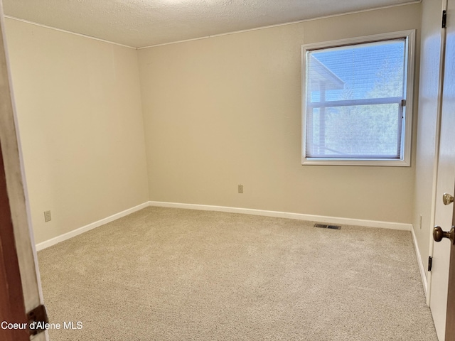 3216 Dufort Rd, Sagle, ID 83860 - unfurnished room with carpet flooring, baseboards, and a textured ceiling