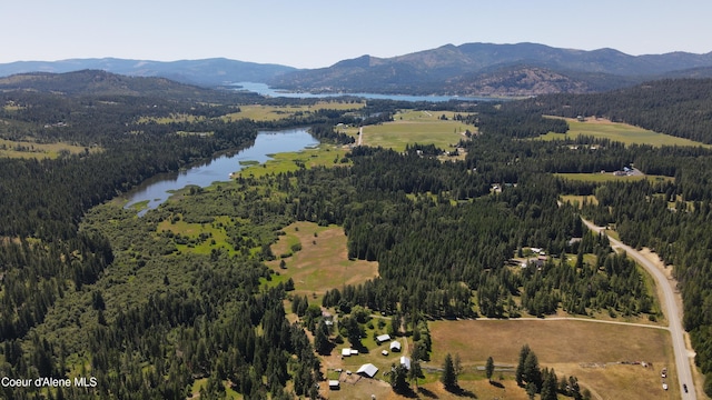 3216 Dufort Rd, Sagle, ID 83860 - drone / aerial view of a water and mountain view and a heavily wooded area
