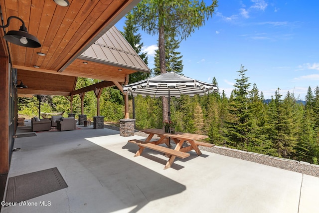 view of patio / terrace featuring outdoor dining area and an outdoor living space