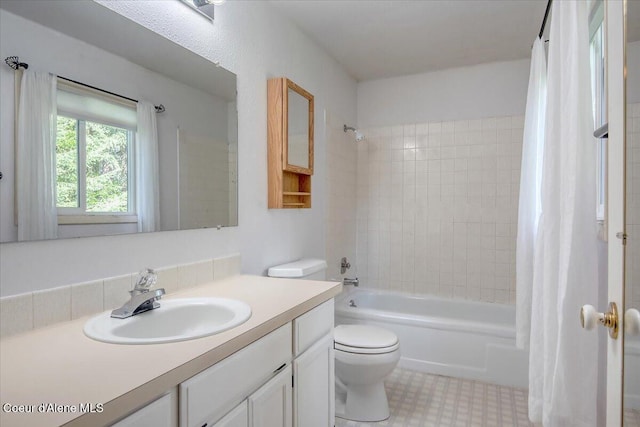 full bathroom with toilet, shower / bath combo, and vanity