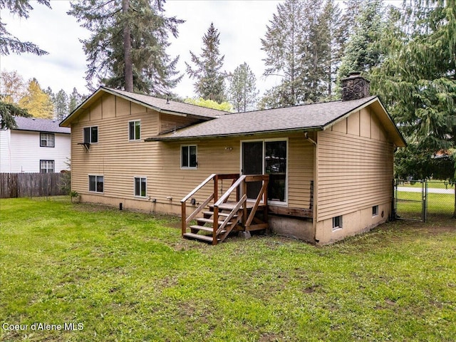 back of property featuring board and batten siding, a chimney, a gate, and roof with shingles