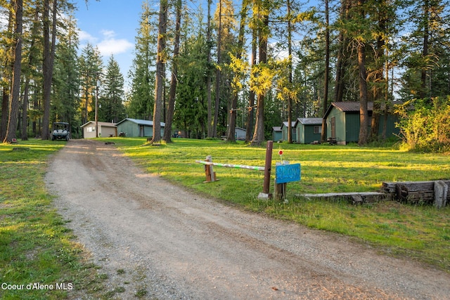 8072 W Radmer Rd, Rathdrum, ID 83858 - view of dirt / gravel driveway featuring view of scattered trees