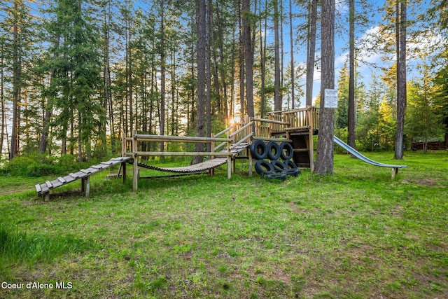 8072 W Radmer Rd, Rathdrum, ID 83858 - view of playground with a yard and view of wooded area