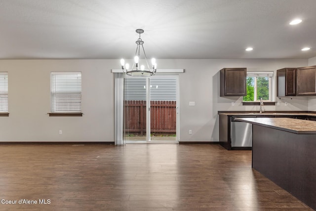 1201 E Locust Ave, Coeur Dalene, ID 83814 - kitchen featuring a chandelier, stainless steel dishwasher, dark brown cabinets, dark wood finished floors, and hanging light fixtures
