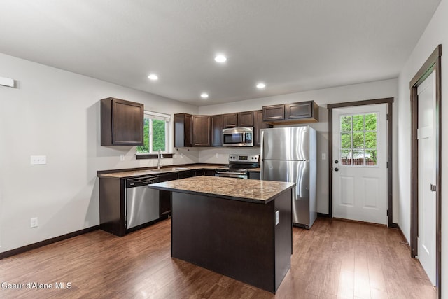 1201 E Locust Ave, Coeur Dalene, ID 83814 - kitchen featuring stainless steel appliances, dark brown cabinets, healthy amount of natural light, wood finished floors, and recessed lighting