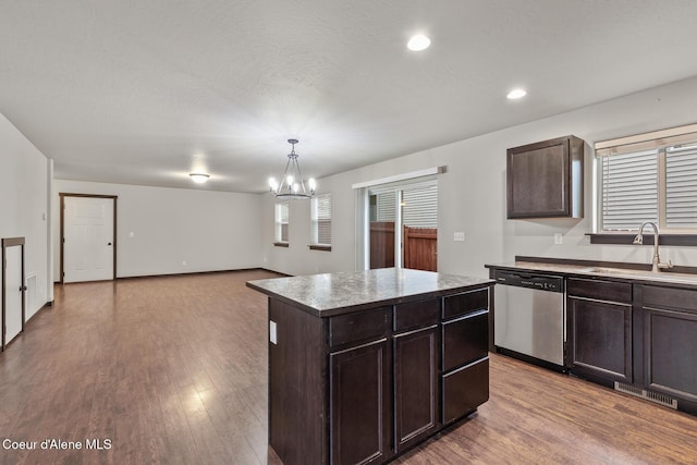 1201 E Locust Ave, Coeur Dalene, ID 83814 - kitchen with dishwasher, a sink, a chandelier, dark brown cabinetry, and light wood finished floors
