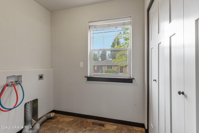 1201 E Locust Ave, Coeur Dalene, ID 83814 - laundry room with electric dryer hookup, baseboards, and washer hookup