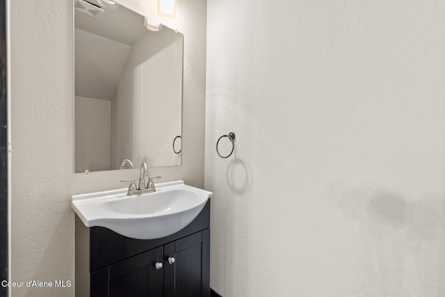 1201 E Locust Ave, Coeur Dalene, ID 83814 - bathroom with vanity and a textured wall