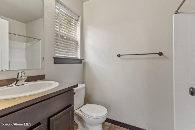 1201 E Locust Ave, Coeur Dalene, ID 83814 - bathroom with vanity, a shower, and toilet