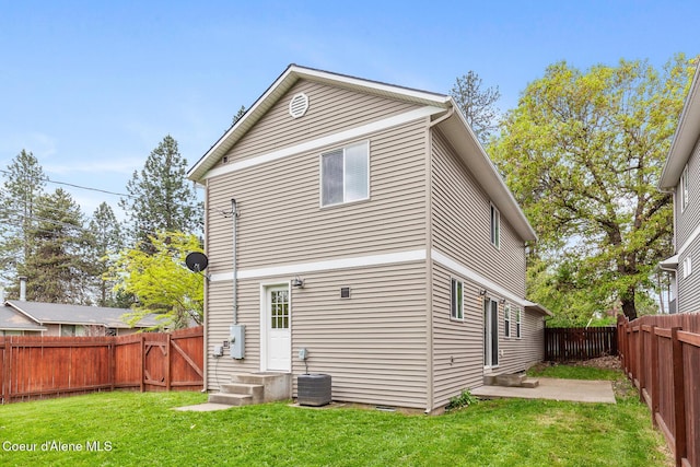 1201 E Locust Ave, Coeur Dalene, ID 83814 - rear view of house with entry steps, central air condition unit, and a patio area