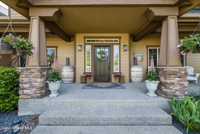 doorway to property featuring a porch