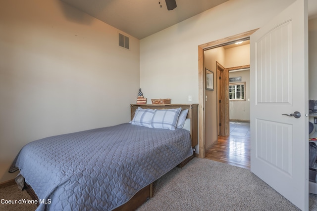 carpeted bedroom with ceiling fan