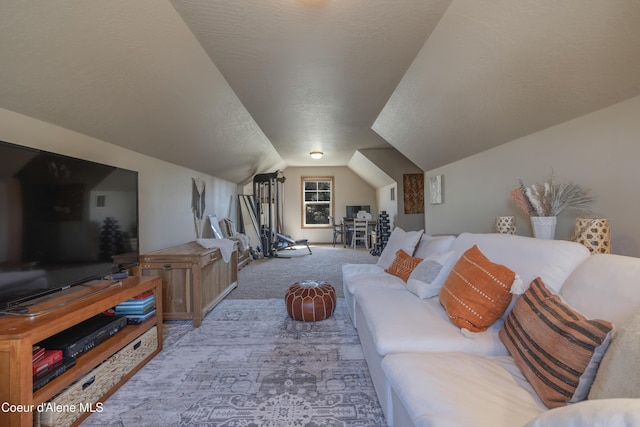 carpeted living area featuring lofted ceiling