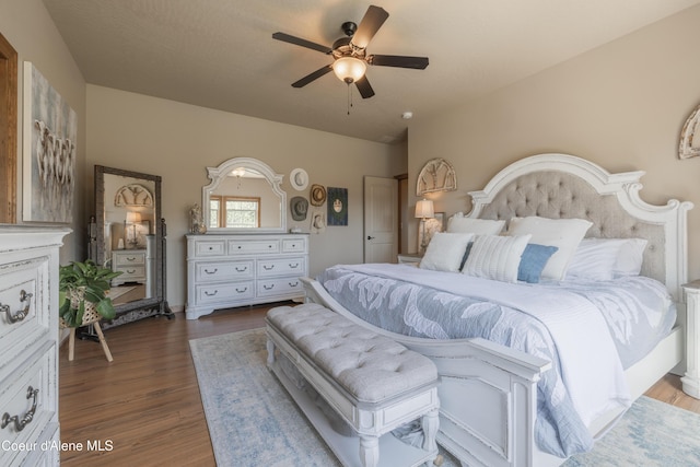 bedroom featuring wood finished floors and a ceiling fan