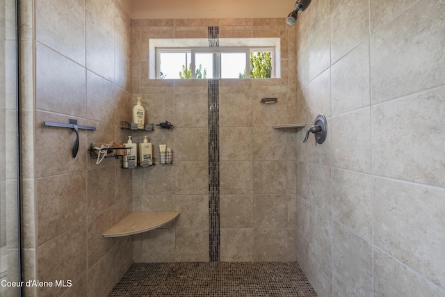 bathroom with tiled shower