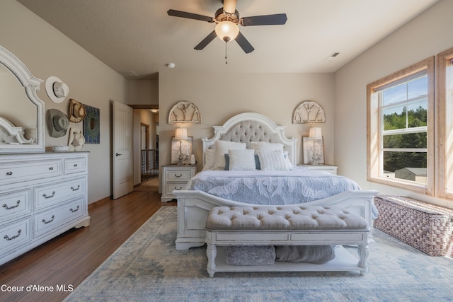 bedroom with wood finished floors and ceiling fan