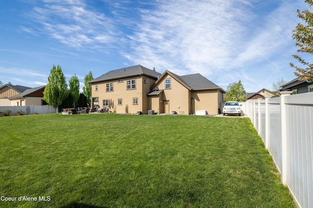 back of house with a residential view and cooling unit