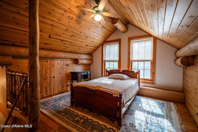 bedroom with wood-type flooring, wood ceiling, lofted ceiling, and rustic walls