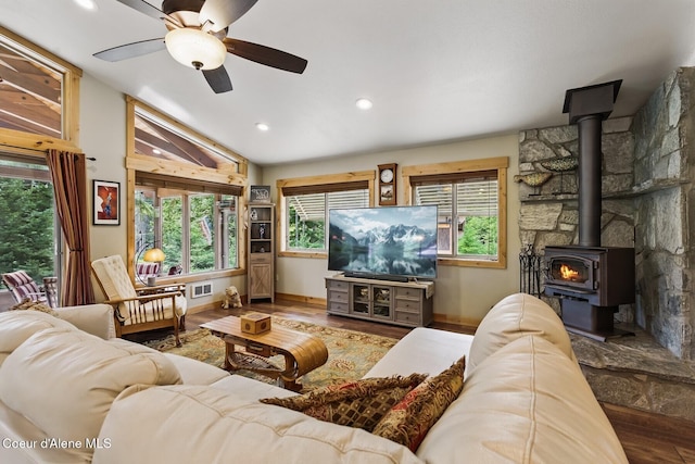 304 Hagman Rd, Nordman, ID 83848 - living area with a wood stove, wood finished floors, a ceiling fan, vaulted ceiling, and recessed lighting
