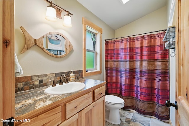 304 Hagman Rd, Nordman, ID 83848 - full bath featuring toilet, vanity, and a shower with shower curtain