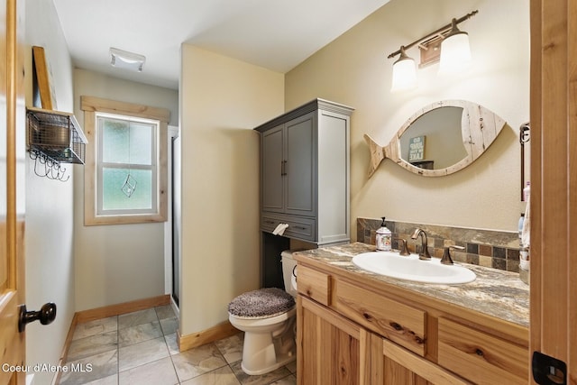 304 Hagman Rd, Nordman, ID 83848 - bathroom with toilet, vanity, a shower stall, and baseboards